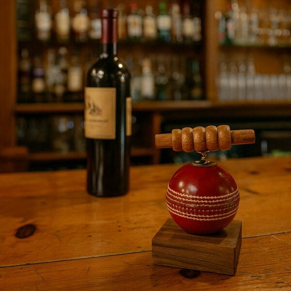 CRICKET-GIFTS Corkscrew with Cricket Ball Base and Genuine Cricket Bails