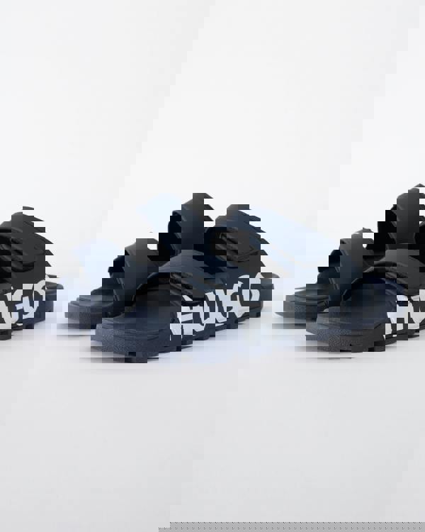 Studio shot of HUGO Evander Mens Logo Sandals with Double Touch-Closure Straps in Dark Blue