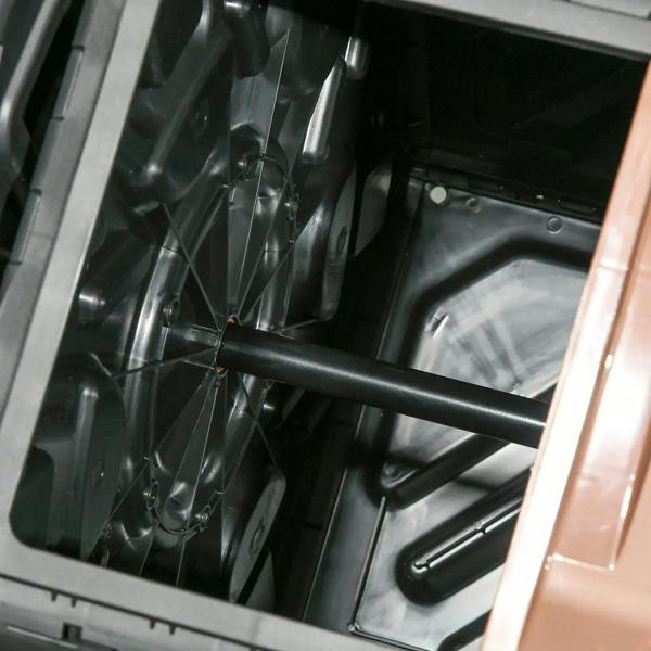 Dual-chamber composter interior with black baffles and central mixing axle
