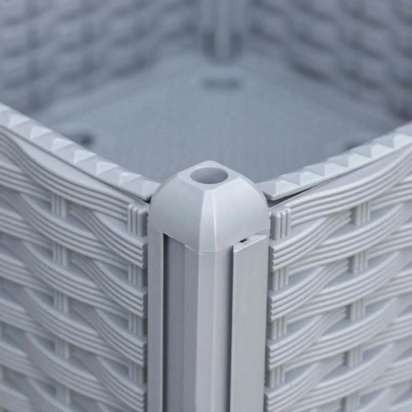 Close-up of grey rattan-effect planter corner with woven pattern and raised top