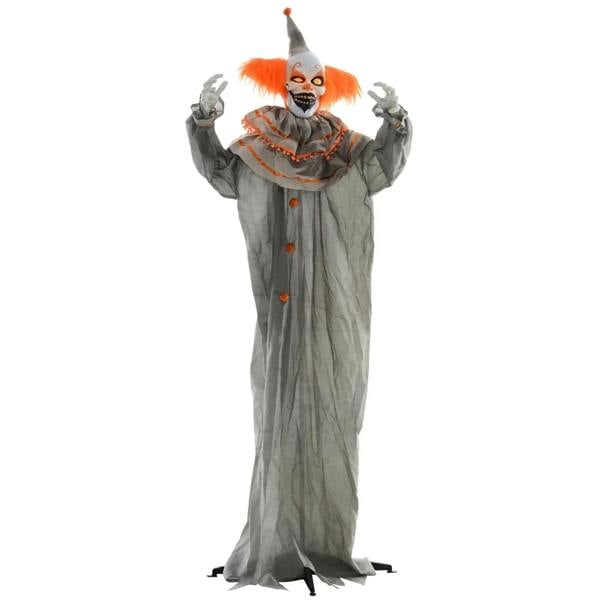 Skull-faced clown animatronic in long gray robe with orange mane, glowing eyes