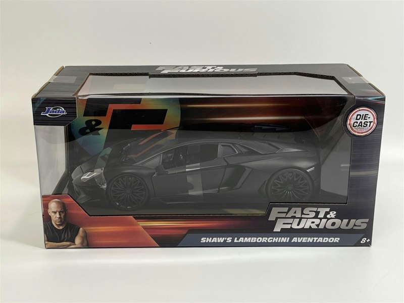 a black toy car in a box