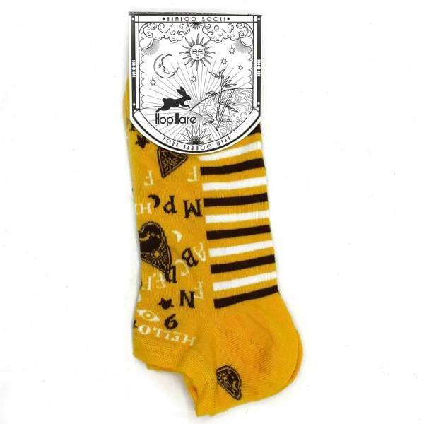 Yellow low-cut bamboo socks with black stripes and Ouija-style letter print