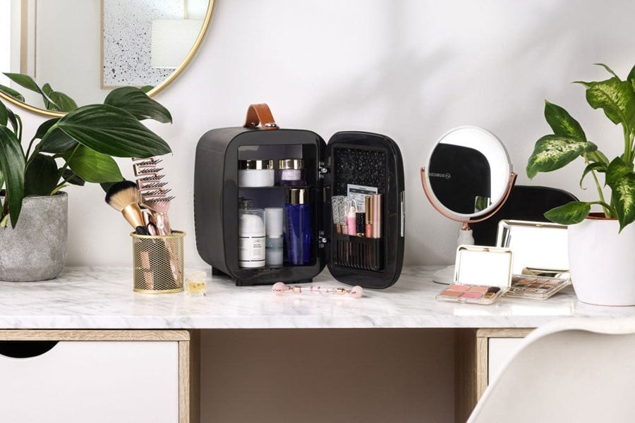 Subcold Pro 4 litre black skincare fridge with cosmetics, beauty and makeup products