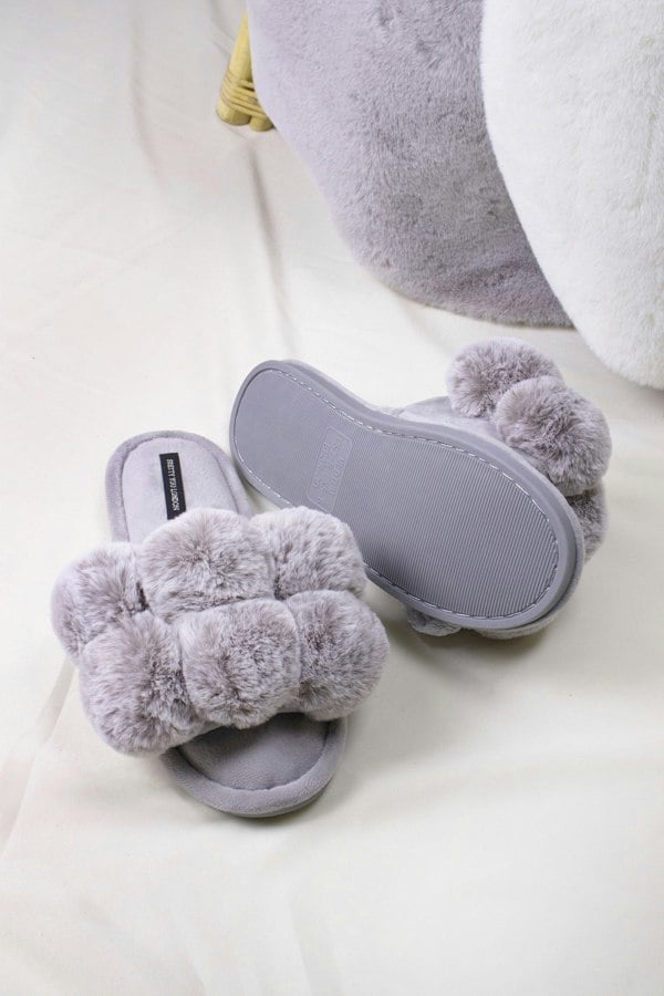 Dolly women's slider slippers in grey with oversized faux fur pom poms from Pretty You London