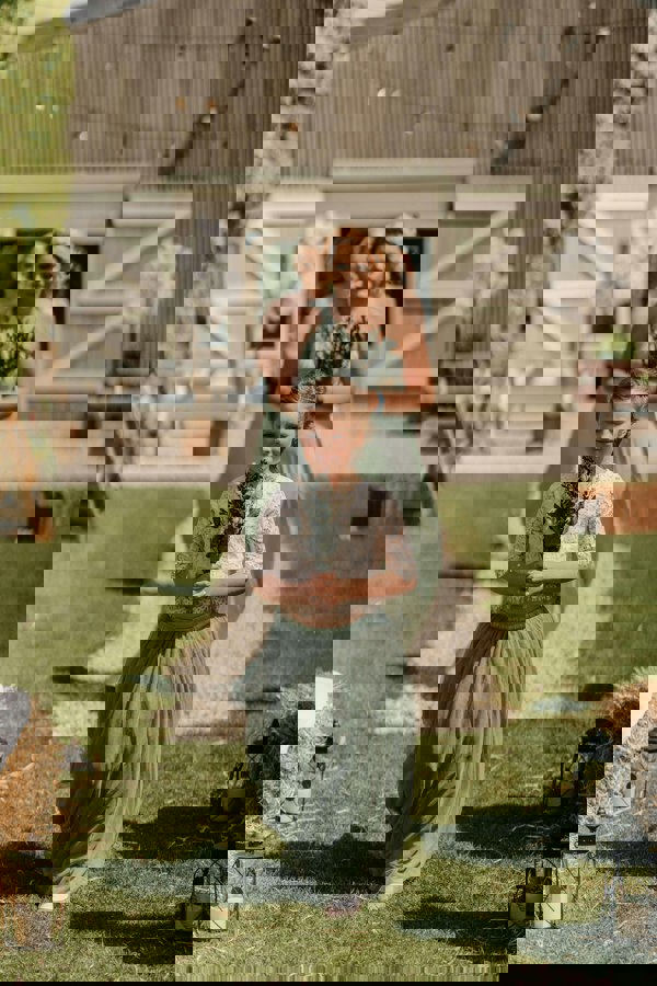 Young flower girl followed by bridesmaids