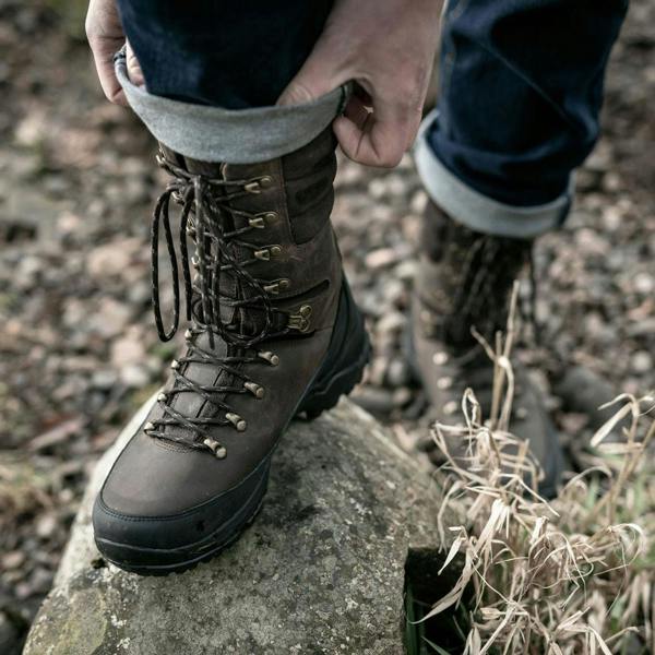 Man wearing the Hoggs of Fife Aonach II field boot out walking on rocks and gravel