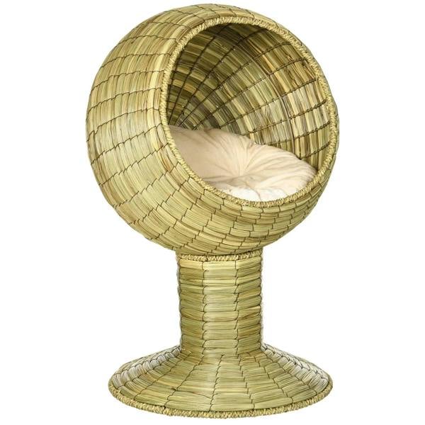 Raised woven rattan cat bed with circular tunnel and cream cushion, natural yellow