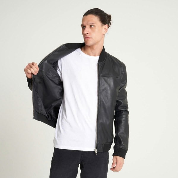 Image displays the untextured leather jacket on a male model unzipped and open to expose the inner pocket.