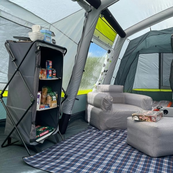 An image of the inside of the Home 5 Berth Inflatable Family Tent from OLPRO showing the inner tents and a camping storage cupboard.