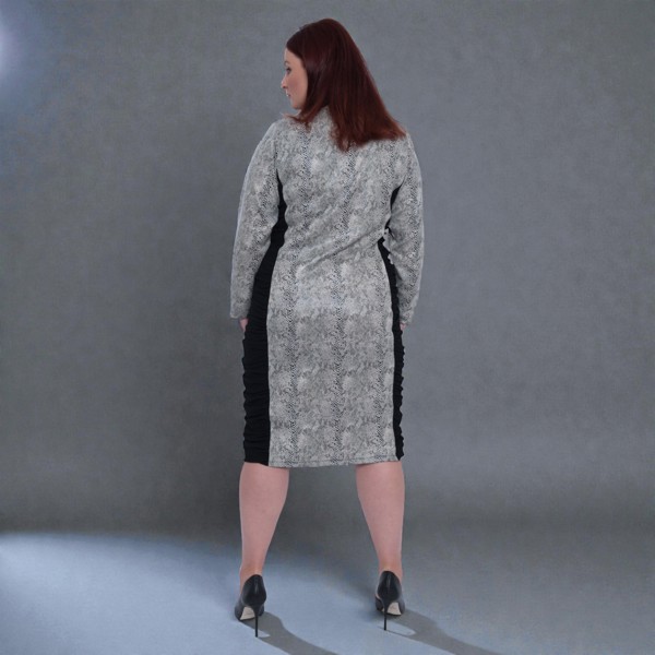 Women's Plus Size Black White Animal Print Bodycon Midi Vegan Leather Dress shown from the back, styled with black heels for a chic look.Plain Background.