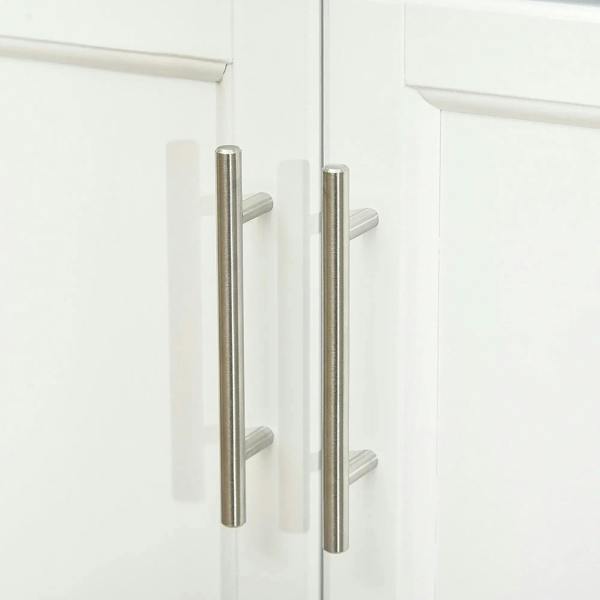 Stainless bar handles on white cabinet doors of the kitchen island cart