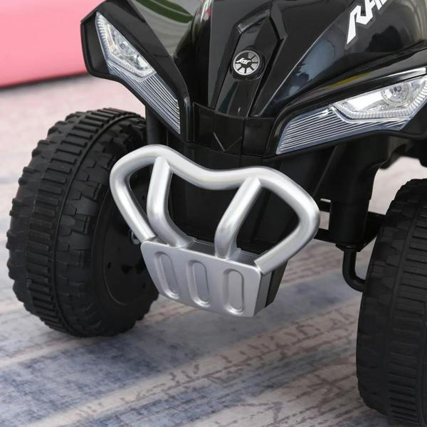 Black ride-on quad front bumper guard with headlights and treaded tires