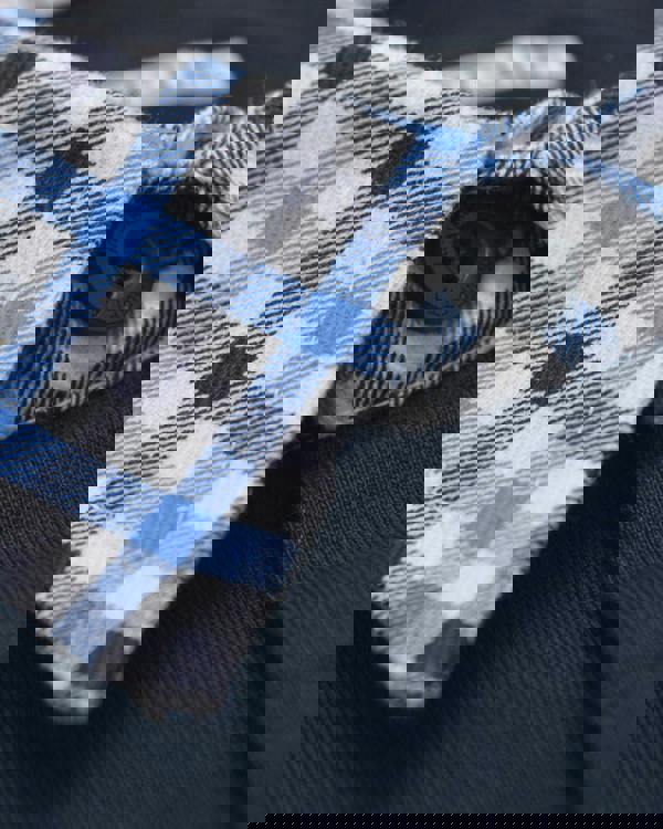 Lambretta Mens Classic Dress Gingham Mod Retro Ska Casual Polo, close-up of shirt collar with blue, black, and white checkered gingham fabric and a black button.