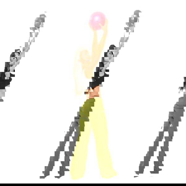 Woman holding red Fitness Mad 9 Inch Exer-Soft Ball in the air with both hands 