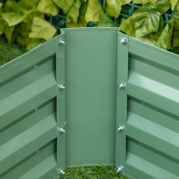Green raised garden bed corner joint with metal bolts and slatted panels