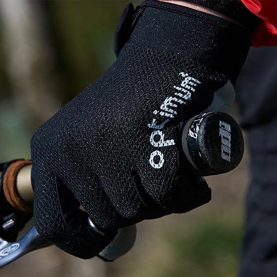 Gloved hand on handlebar grip wearing black Hawkley MTB cycling glove with white Optimum logo - Optimum