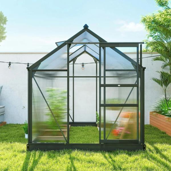 Grey polycarbonate greenhouse with sliding door and end window, side angle