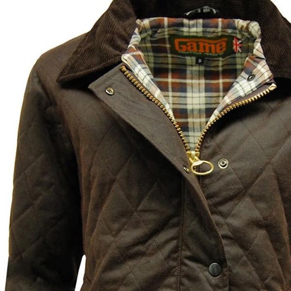 Close-up of the Game Zara Quilted Wax Jacket fabric showing waxed cotton finish and quilted stitching