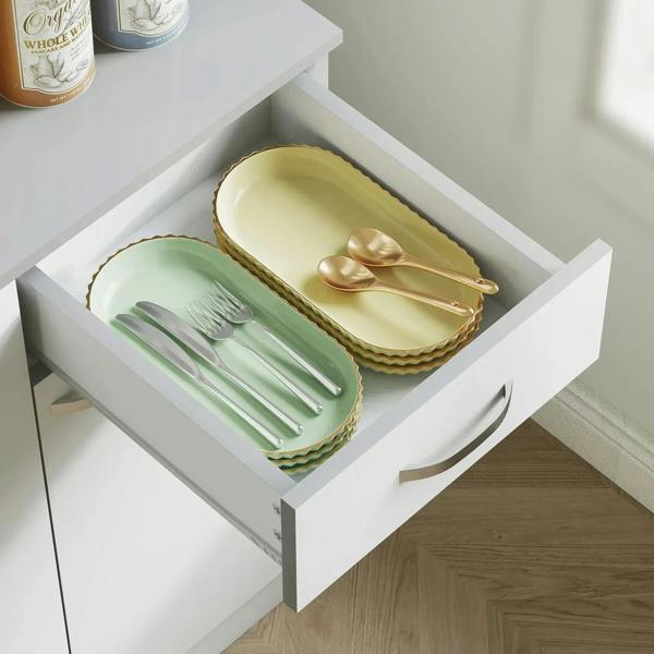 White pull-out drawer with divided cutlery tray holding utensils and small plates