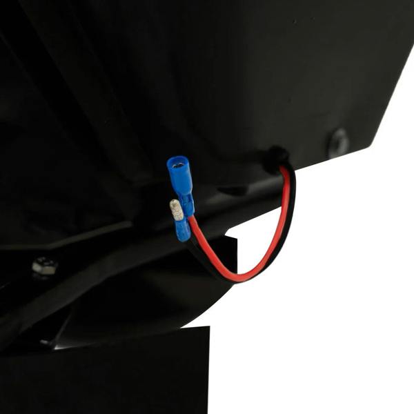 Close-up of the ATV mounted spreader’s wiring, featuring a blue connector and red wire against a black background, highlighting its durable design