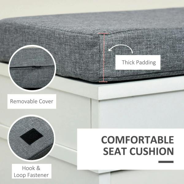 Gray padded seat cushion on a white shoe storage bench with removable cover detail