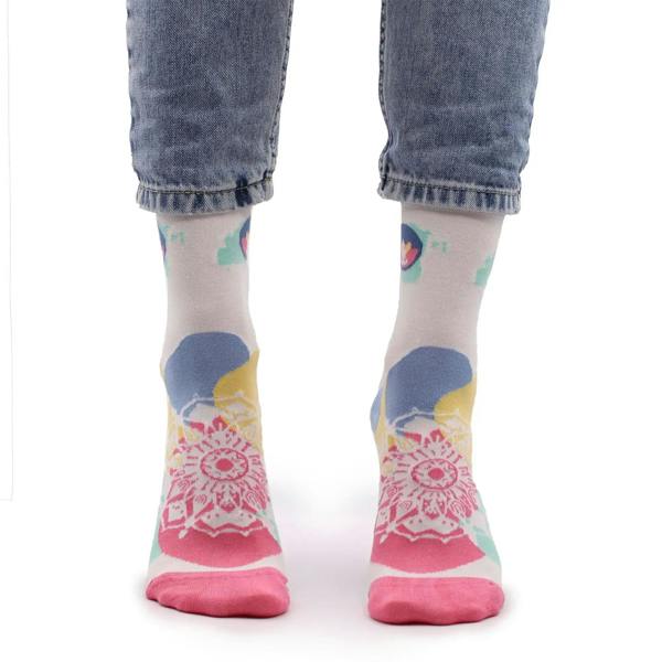 Light gray crew socks with colorful round graphic, blue/yellow shapes, and pink mandala