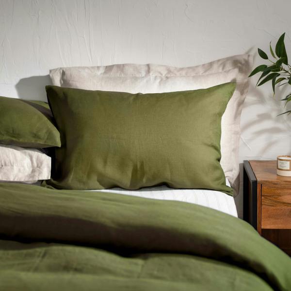 Olive Green French Linen 40cm Deep Fitted Sheets styled in a bedroom | Soak and Sleep
