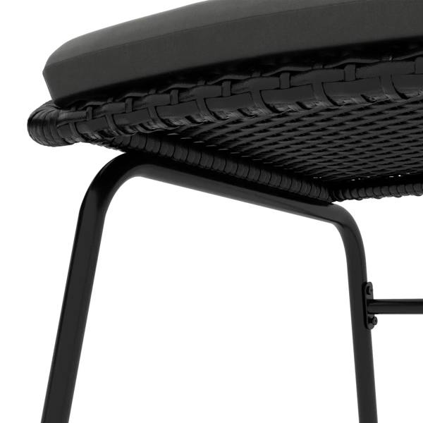Black rattan armchair armrest close-up with woven texture and curved frame