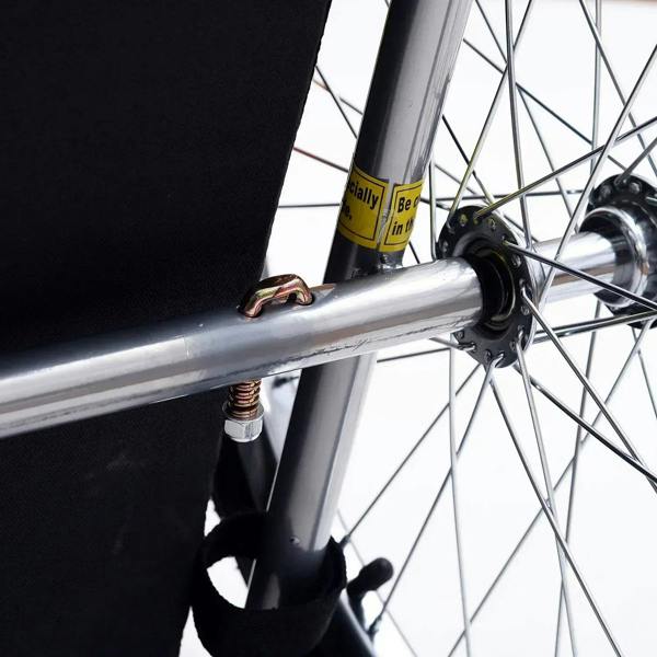 Steel bicycle frame wheel hub and hitch connector on red and black pet trailer