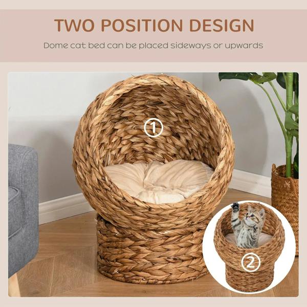 Two-position rattan cat bed with cushion inside, domed opening placed upright