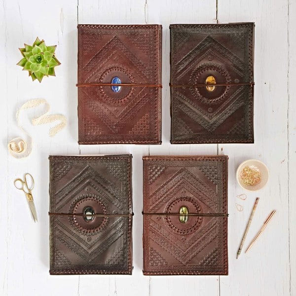 Four Indra A4 Embossed & Stitched Leather Journals with Semi-Precious Stone. Available in lapis, tiger's eye, labradorite and black onyx.