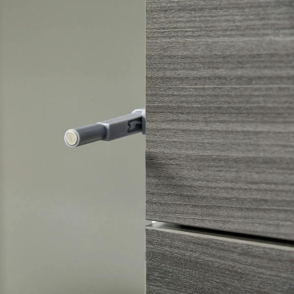 Grey push-open mechanism detail on sideboard cabinet