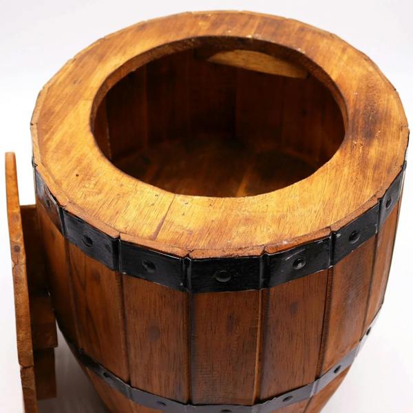 Wooden barrel top with open center and black metal band ring around the rim