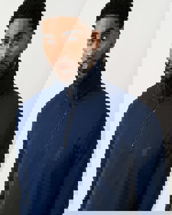 detail shot of a Model wearing a BOSS Orange Zetrust Mens 1/4 Zip Sweatshirt in Open Blue