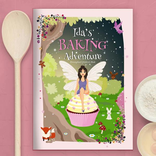 Personalised Fairy Baking Adventure storybook titled Ida's Baking Adventure featuring Sugardust the Fairy on a cupcake next to a wooden spoon