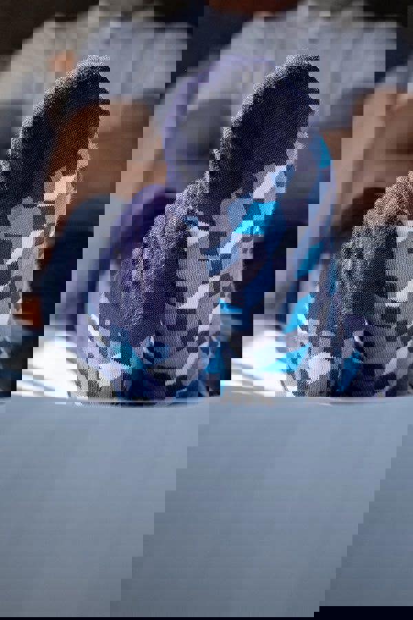 Person wearing blue patterned soft socks on a blurred background