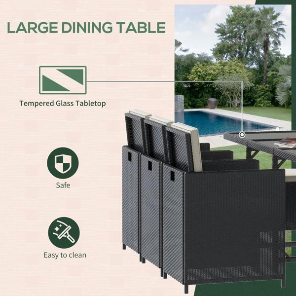 Black rattan dining table set with tempered glass tabletop and matching armchairs