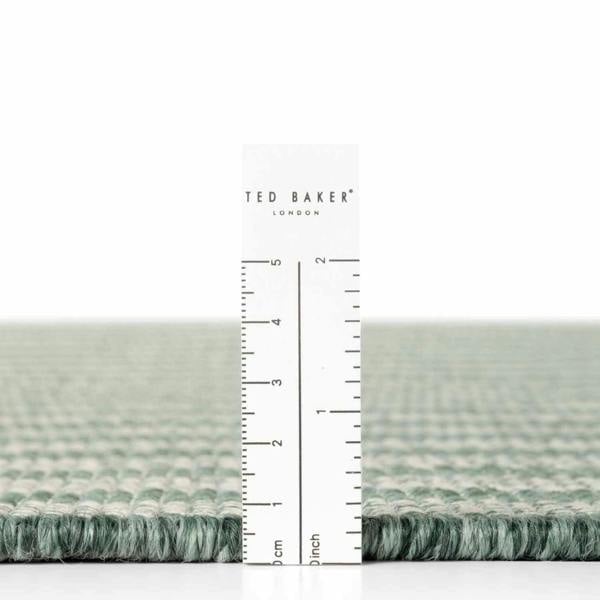 Ted Baker fabric swatch with a ruler for scale on a white background