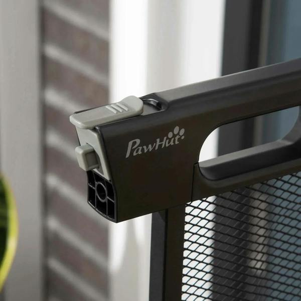 Close-up of PavHut handle on a black mesh pressure-fit safety gate