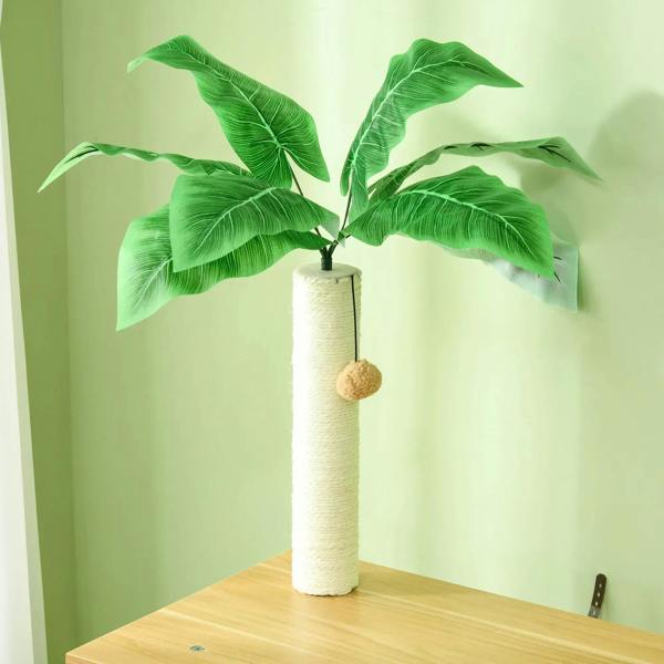 Tall cat scratching post with leaf top and hanging ball over oak platform, green post
