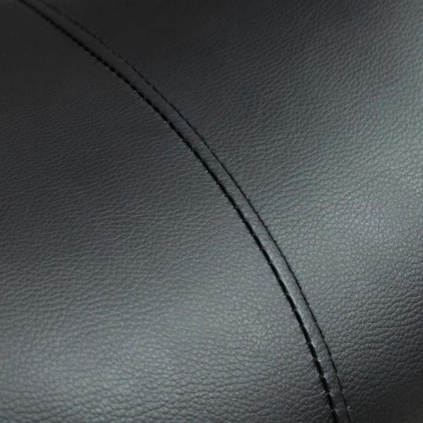 Close-up of black faux leather saddle stool seat with visible seam stitching