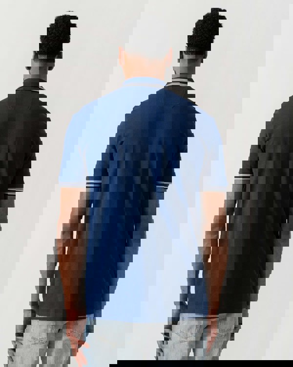 Model wearing BOSS Green Mens Paddy Cotton-Piqué Polo Shirt with Contrast Logo in Navy 419 - back