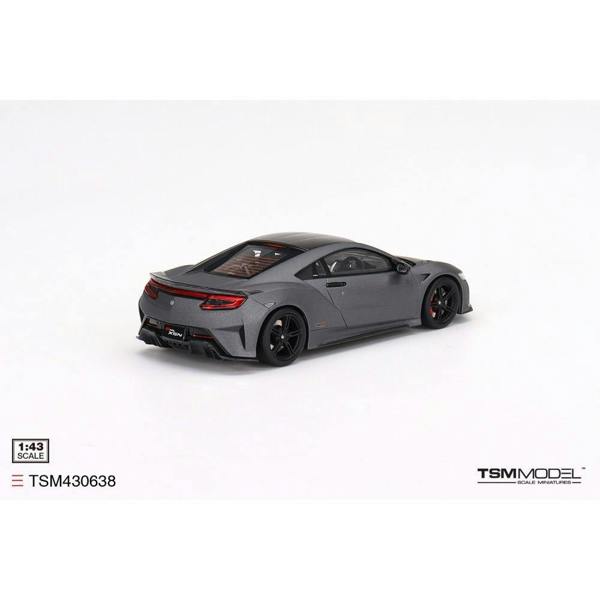 a grey sports car on a white background