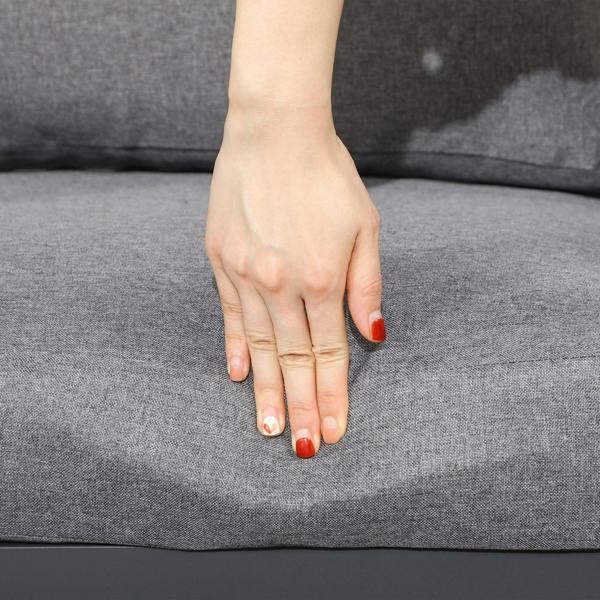 Grey seat cushion with soft fabric surface and visible stitching edge