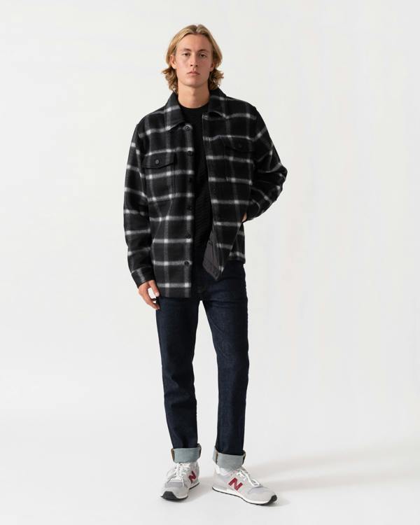 Man wearing the BOSS Orange Losky Mens Long Sleeve Check Shirt - Black 001