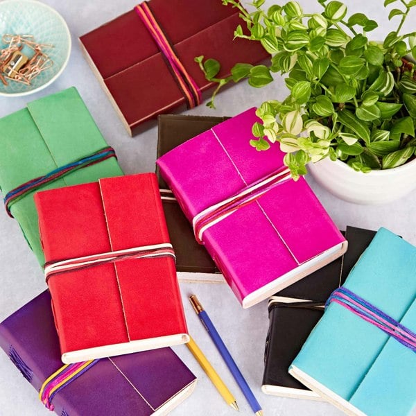 Handmade leather journal with a three coloured string.