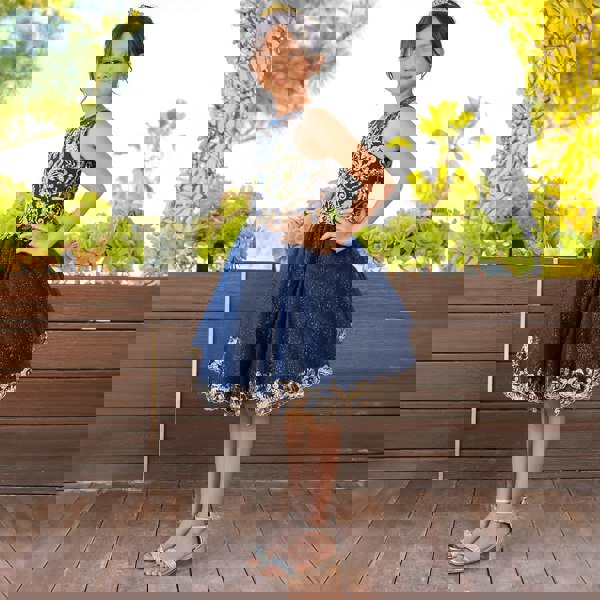 Girl wearing a beautiful navy and gold sequin dress