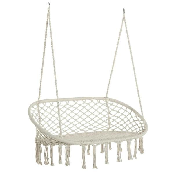 Cream hanging macrame hammock chair with oval net seat and fringe tassels