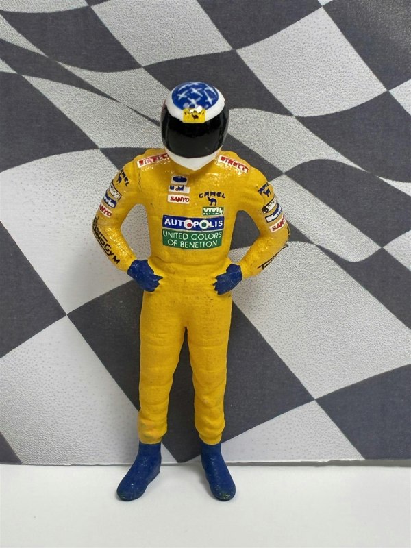 a toy figure of a race car driver